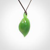 Hand carved New Zealand jade, single twist pendant. Maori pikorua pendant hand carved in New Zealand. Made by NZ Pacific, jade jewellery for sale online. One only hand made by Ross Crump.
